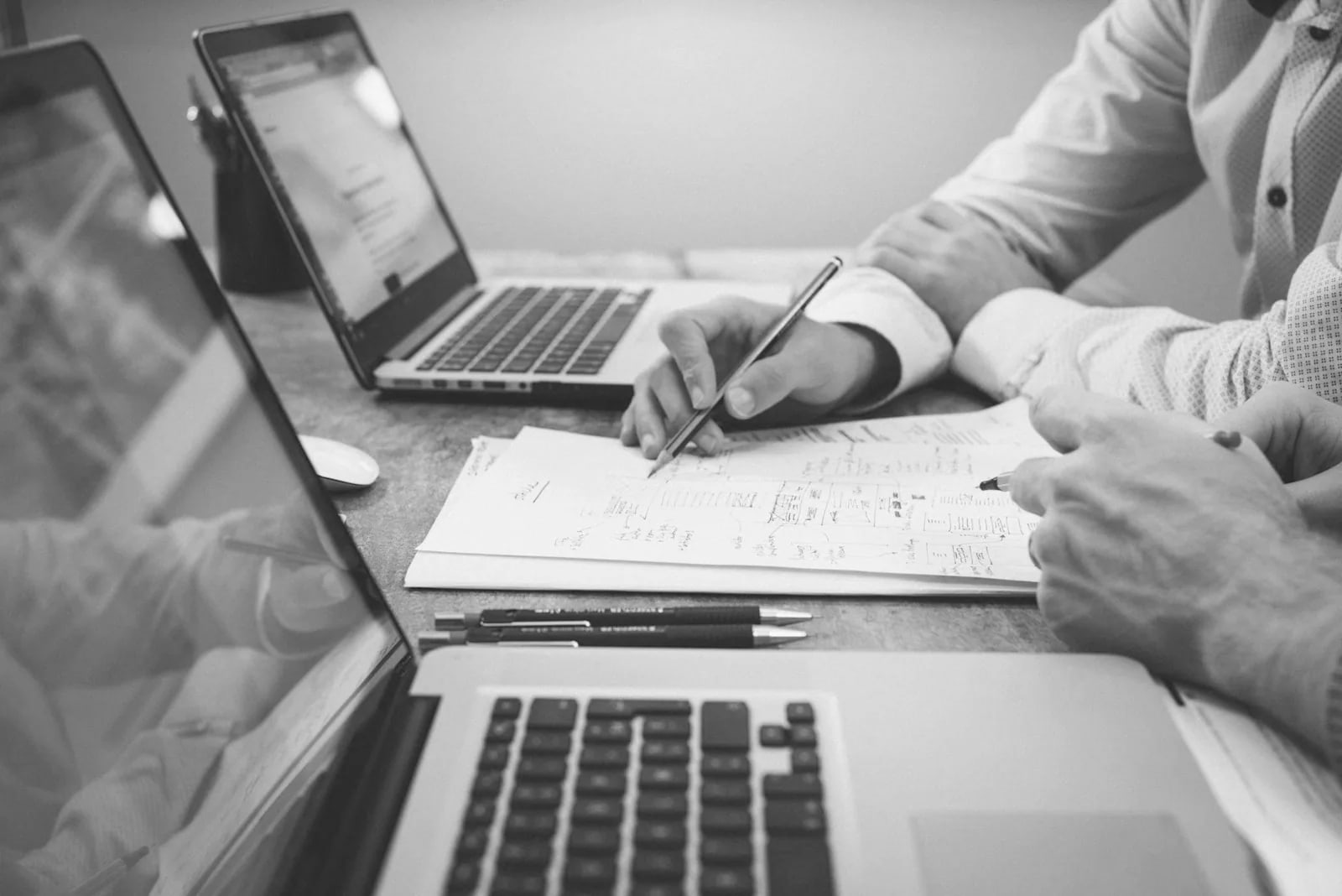 Documents and a laptop on a desk